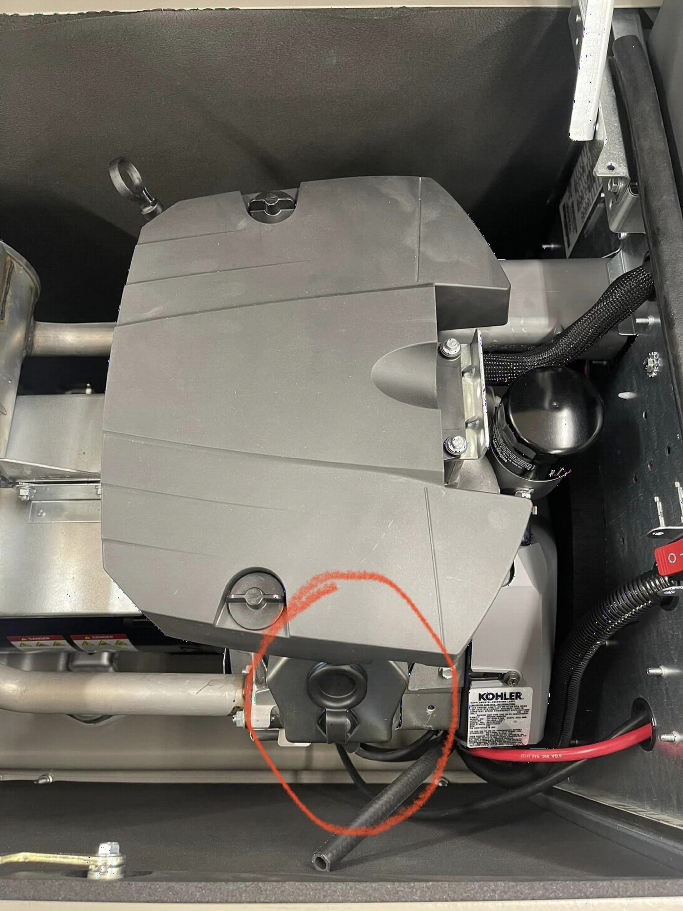 Generator valve cover location showing where to add oil