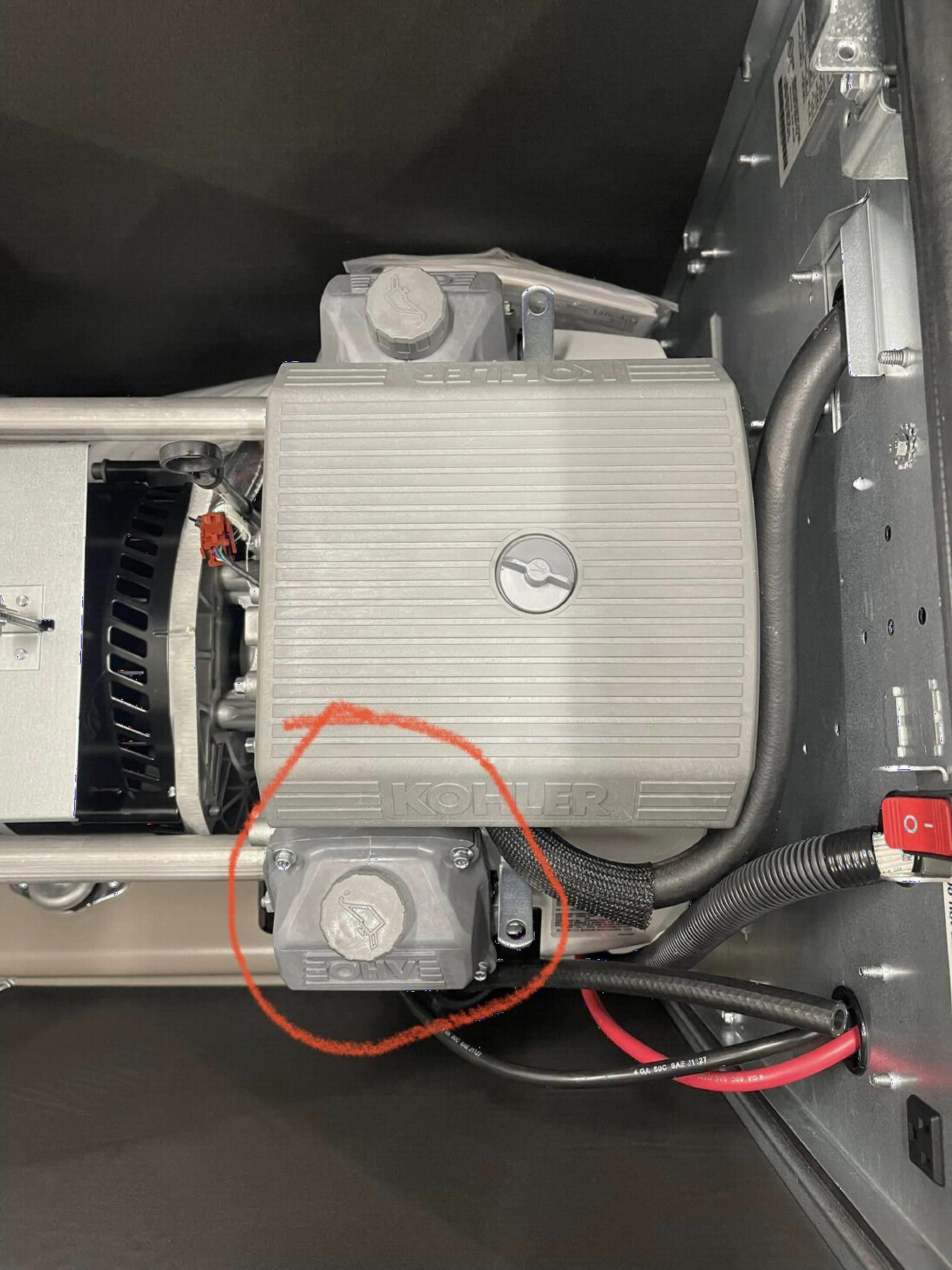 Second valve cover location on a standby generator